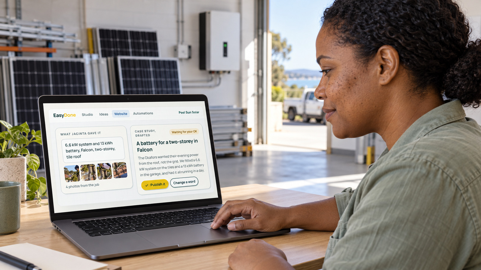 A solar business owner reviews a Falcon battery-install case study in EasyDone Studio at her Mandurah workshop.
